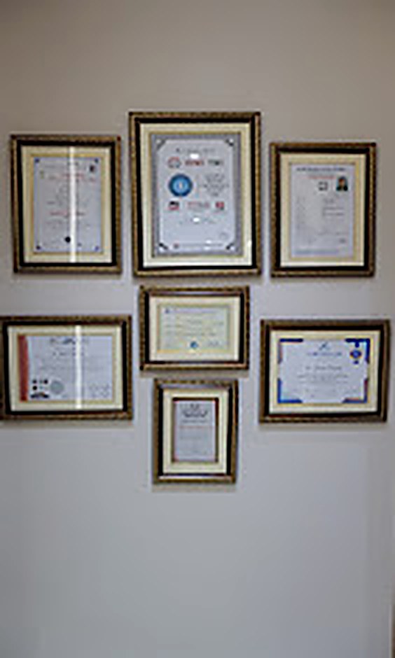 Certifications and recognitions on the clinic wall